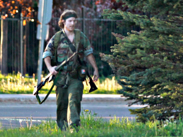 Justin Bourque in fatigues with rifle