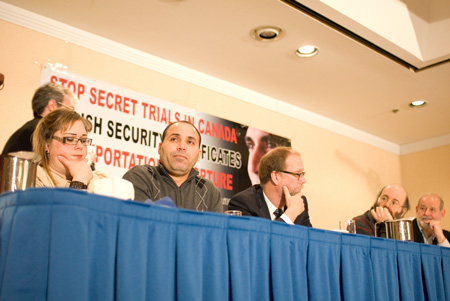 Justice Denied: Mohamed Harkat (second from left) with his wife, Sophie, and the author (second from right) at a 2010 press conference following the Federal Court decision upholding the security certificate against Harkat. (Photo by Secret Trial 5 Productions)