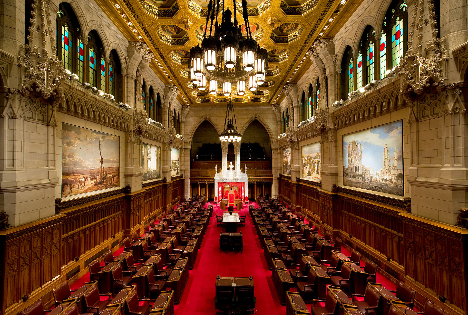 Image of Canadian senate, wooden benches and red carpet