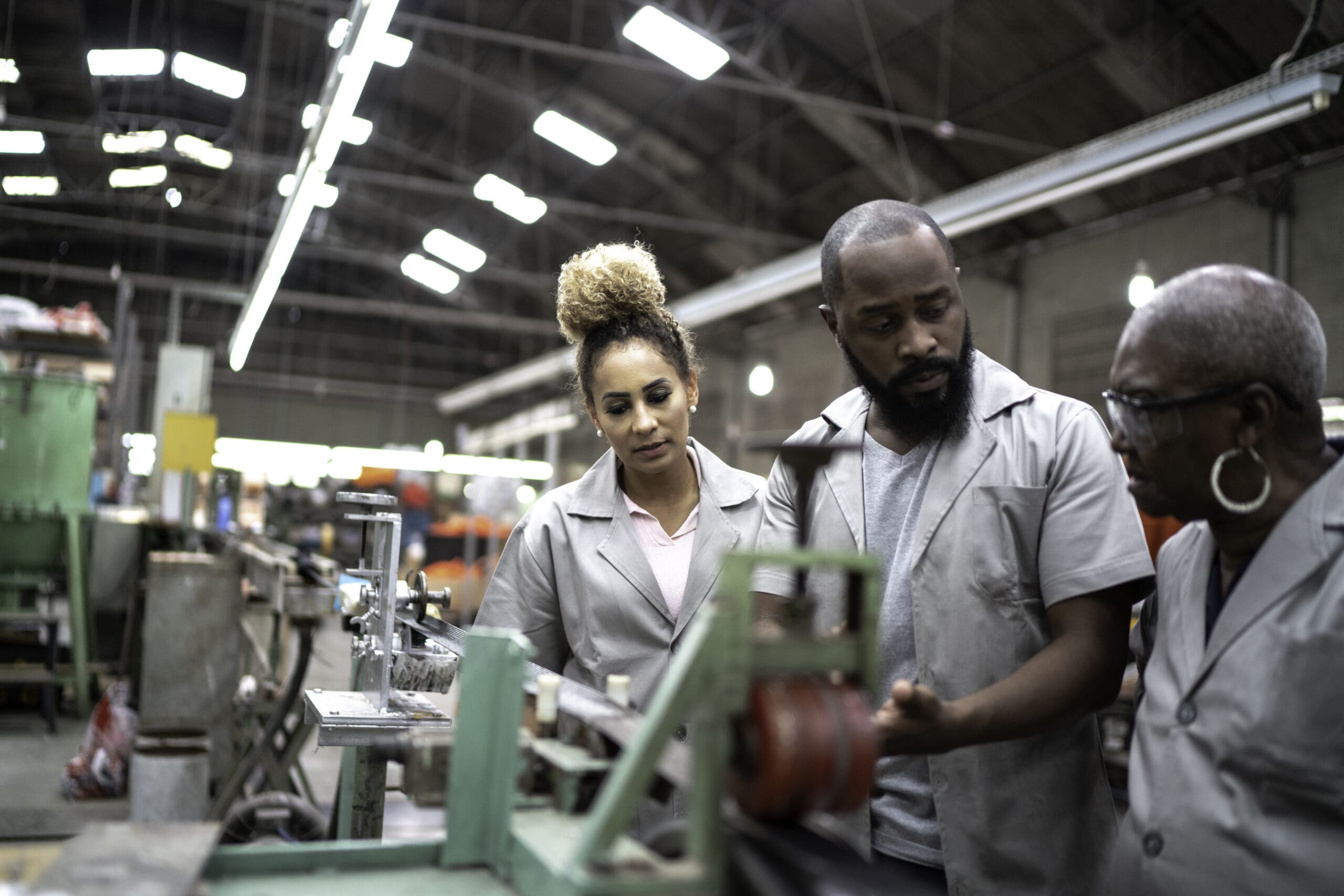 Two people working in a factory