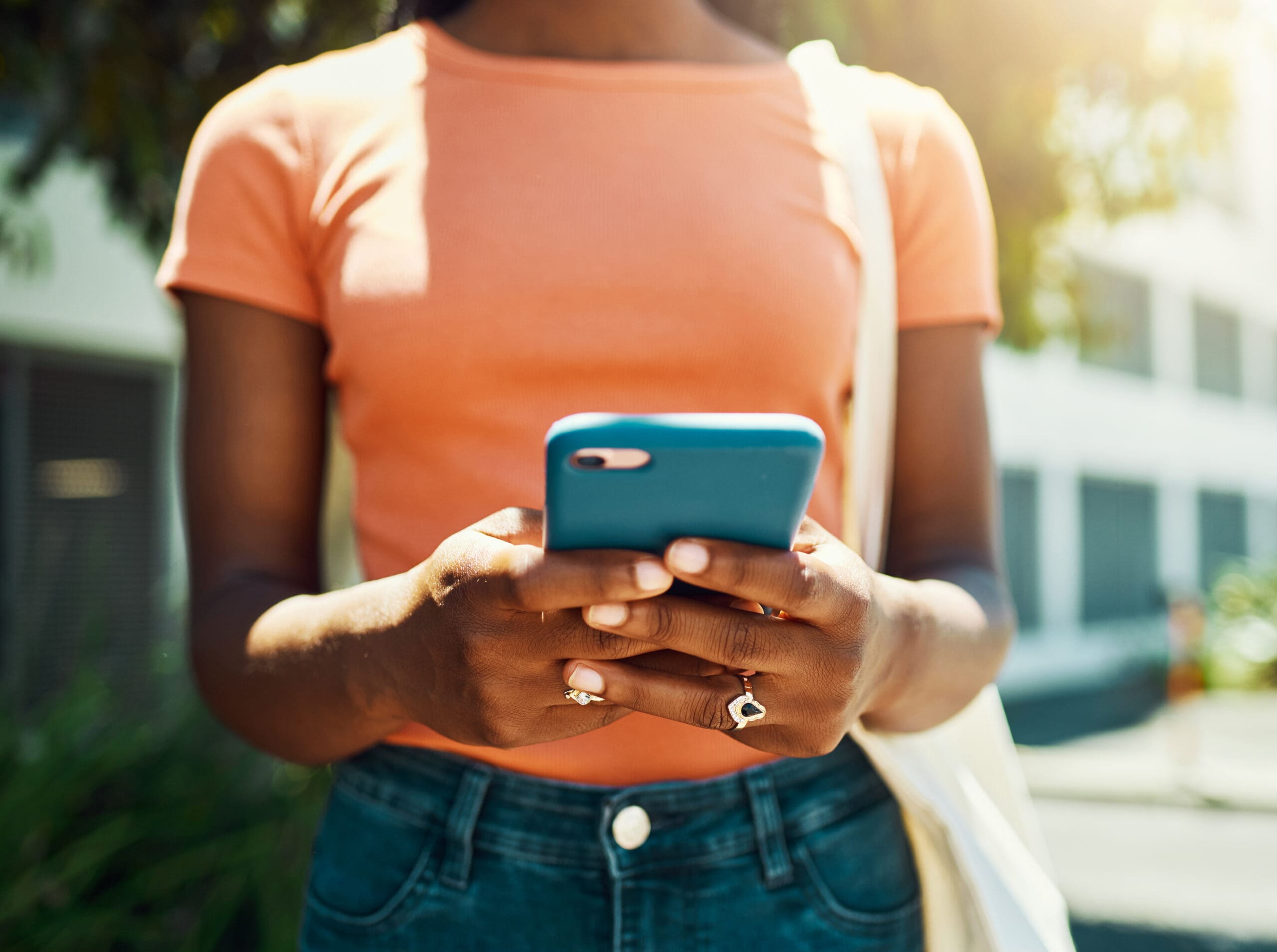 Shot of an unrecognisable woman using a smartphone during a day out in the city