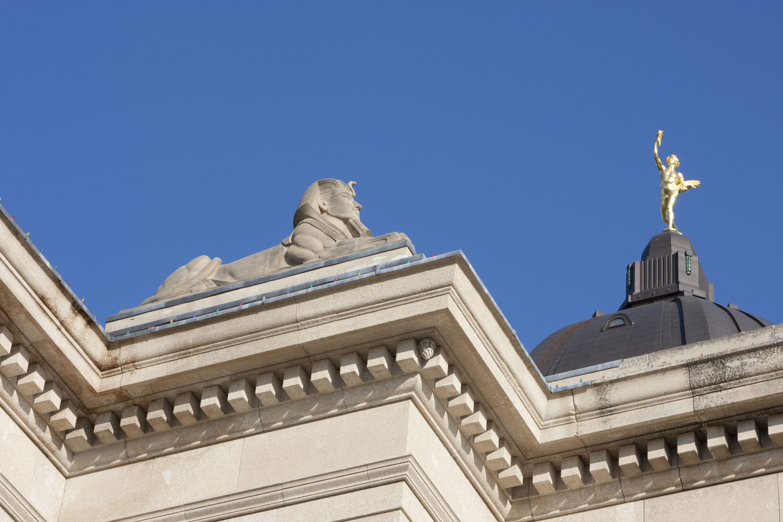 "Image of the Spinx, with the Golden Boy on top of the Legislator building in Winnipeg, manitoba, Canada."